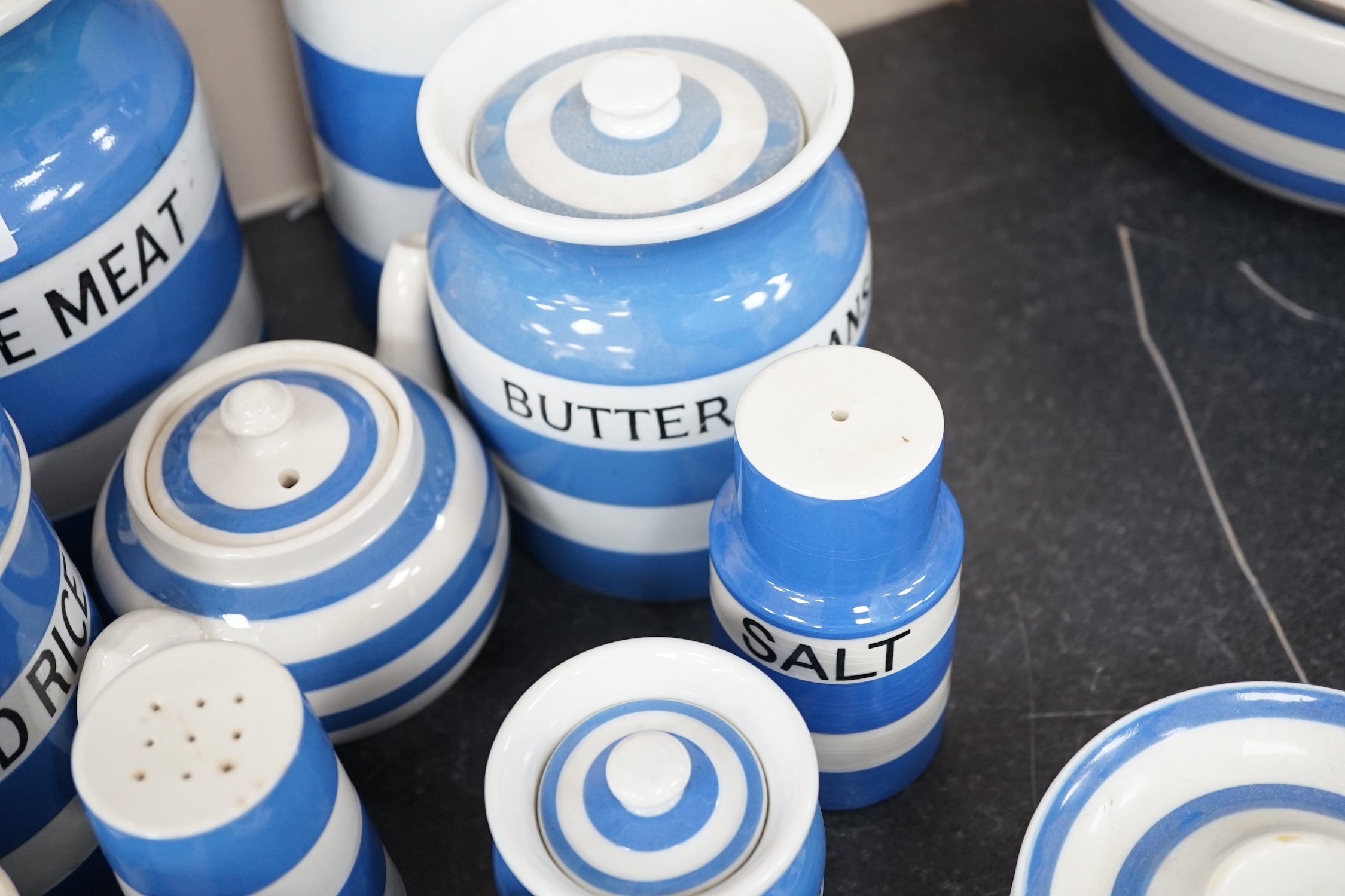 A quantity of unmarked and non T.G.Green blue and white Cornishware to include a Mincemeat jar and cover, egg cups, bowls, dishes and sifters, approximately eighty pieces. Condition - fair to good